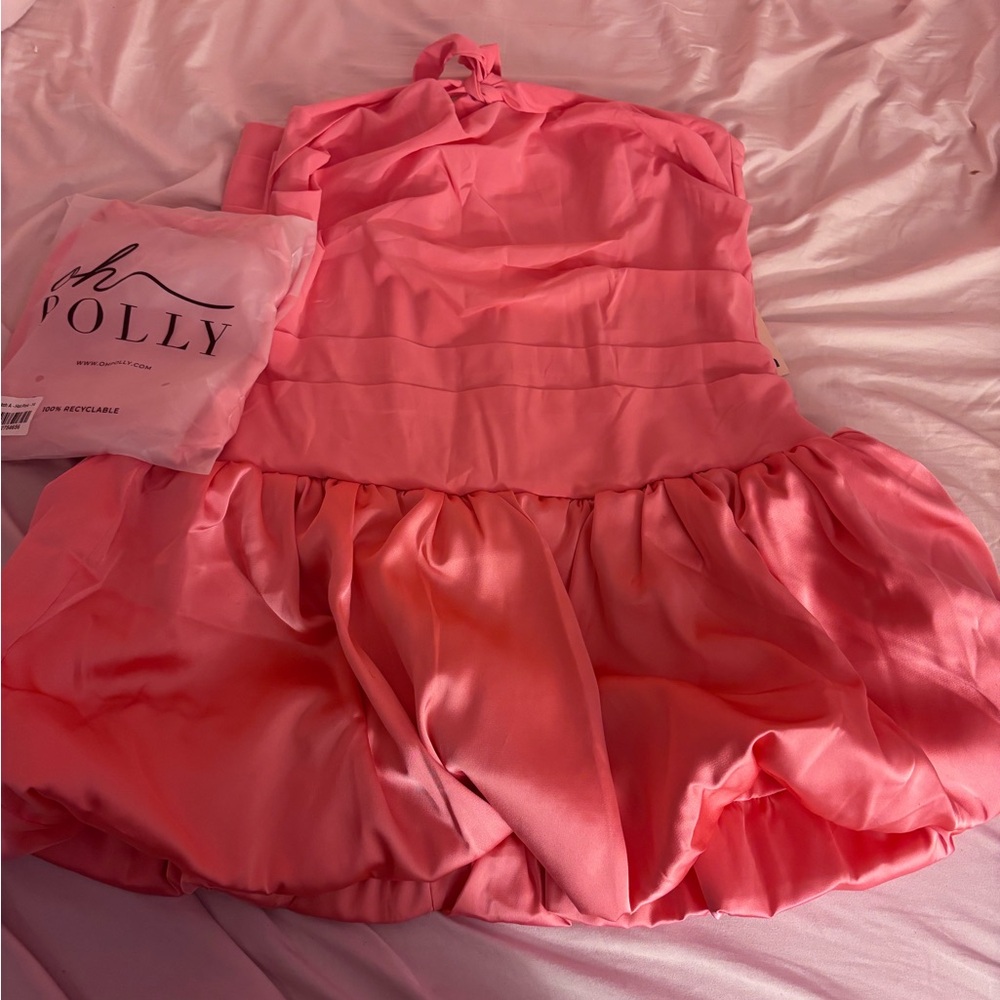 A cute, mini hot pink dress that has never been worn.